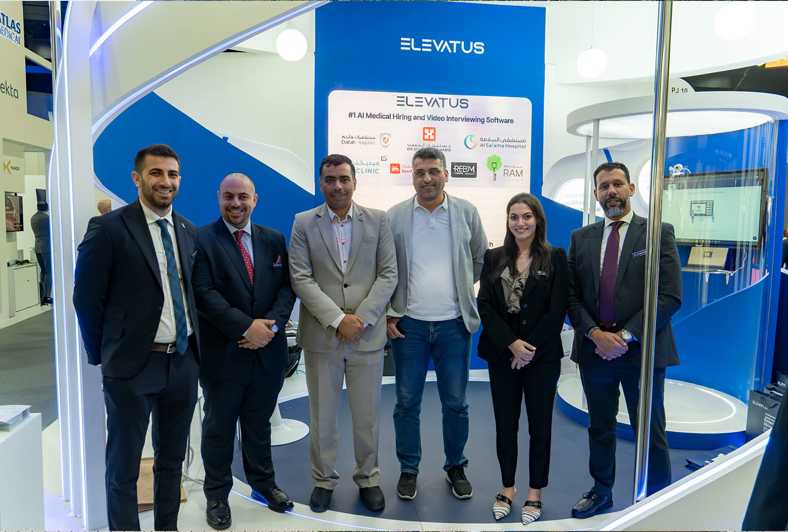 Elevatus team members standing together at their exhibition stand